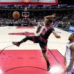 
              Chicago Bulls' Javonte Green (24) dunks the ball as Sacramento Kings' Harrison Barnes watches during the first half of an NBA basketball game Wednesday, Feb. 16, 2022, in Chicago. (AP Photo/Charles Rex Arbogast)
            
