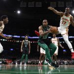 
              Boston Celtics' Al Horford looks for an opening around Atlanta Hawks' Onyeka Okongwu during the first quarter of an NBA basketball game Sunday, Feb. 13, 2022, in Boston. (AP Photo/Winslow Townson)
            