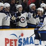 
              Winnipeg Jets left wing Kyle Connor (81) is congratulated after scoring a goal against the Nashville Predators during the second period of an NHL hockey game Saturday, Feb. 12, 2022, in Nashville, Tenn. (AP Photo/Mark Zaleski)
            