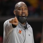 
              Maryland interim head coach Danny Manning points during the first half of the team's NCAA college basketball game against Iowa, Thursday, Feb. 10, 2022, in College Park, Md. (AP Photo/Nick Wass)
            