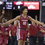 
              Arkansas' Jaylin Williams celebrates with teammates during a timeout in the first half of an NCAA college basketball game against Missouri on Tuesday, Feb. 15, 2022, in Columbia, Mo. (AP Photo/L.G. Patterson)
            