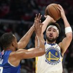 
              Golden State Warriors guard Klay Thompson, right, shoots as Los Angeles Clippers' Rodney Hood defends during the first half of an NBA basketball game Monday, Feb. 14, 2022, in Los Angeles. (AP Photo/Mark J. Terrill)
            