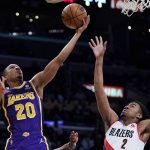 
              Los Angeles Lakers guard Avery Bradley, left, shoots as Portland Trail Blazers forward Trendon Watford defends during the first half of an NBA basketball game Wednesday, Feb. 2, 2022, in Los Angeles. (AP Photo/Mark J. Terrill)
            