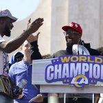 
              Los Angeles Rams linebackers Von Miller, center, and Leonard Floyd, left, celebrate following the team's victory parade in Los Angeles, Wednesday, Feb. 16, 2022, after their win Sunday over the Cincinnati Bengals in the NFL Super Bowl 56 football game. (AP Photo/Marcio Jose Sanchez)
            