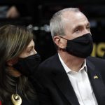 
              New Jersey Gov. Phil Murphy and his wife, Tammy, attend Rutgers' NCAA college basketball game against Ohio State in Piscataway, N.J., Wednesday, Feb. 9, 2022. (AP Photo/Noah K. Murray)
            