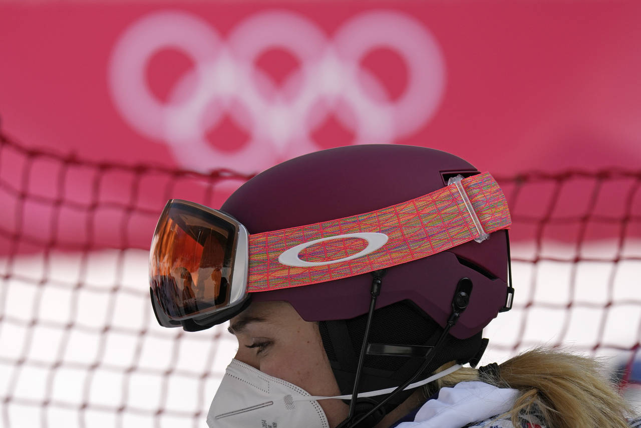 Mikaela Shiffrin, of the United States leaves the finish area after she skied out in the first run ...