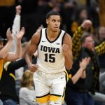 
              Iowa forward Keegan Murray celebrates after making a basket at the end of the first half of an NCAA college basketball game against Michigan, Thursday, Feb. 17, 2022, in Iowa City, Iowa. (AP Photo/Charlie Neibergall)
            