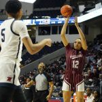 
              South Carolina guard Brea Beal (12) attempts a three-point shot past Mississippi forward Snudda Collins (5) during the first half of an NCAA college basketball game in Oxford, Miss., Sunday, Feb. 27, 2022. (AP Photo/Rogelio V. Solis)
            