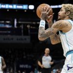 
              Charlotte Hornets guard Kelly Oubre Jr. shoots the ball against the Toronto Raptors during the first half of an NBA basketball game in Charlotte, N.C., Monday, Feb. 7, 2022. (AP Photo/Jacob Kupferman)
            