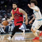 
              Toronto Raptors guard Fred VanVleet (23) brings the ball up the court while guarded by Charlotte Hornets guard LaMelo Ball (2) during the second half of an NBA basketball game in Charlotte, N.C., Monday, Feb. 7, 2022. (AP Photo/Jacob Kupferman)
            