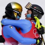
              Nadia Delago, of Italy, left, and teammate Nicol Delago, embrace after finishing the women's downhill at the 2022 Winter Olympics, Tuesday, Feb. 15, 2022, in the Yanqing district of Beijing. (AP Photo/Dmitri Lovetsky)
            