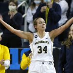 
              Michigan center Izabel Varejao (34) celebrates during the finals second of the team's 62-51 win over Michigan State in an NCAA college basketball game Thursday, Feb. 24, 2022, in Ann Arbor, Mich. (AP Photo/Duane Burleson)
            