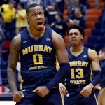 
              Murray State forward K.J. Williams (0) and guard Carter Collins (13) celebrate after they defeated Tennessee-Martin in an NCAA college basketball game Saturday, Feb. 19, 2022, in Martin, Tenn. (AP Photo/Mark Zaleski)
            