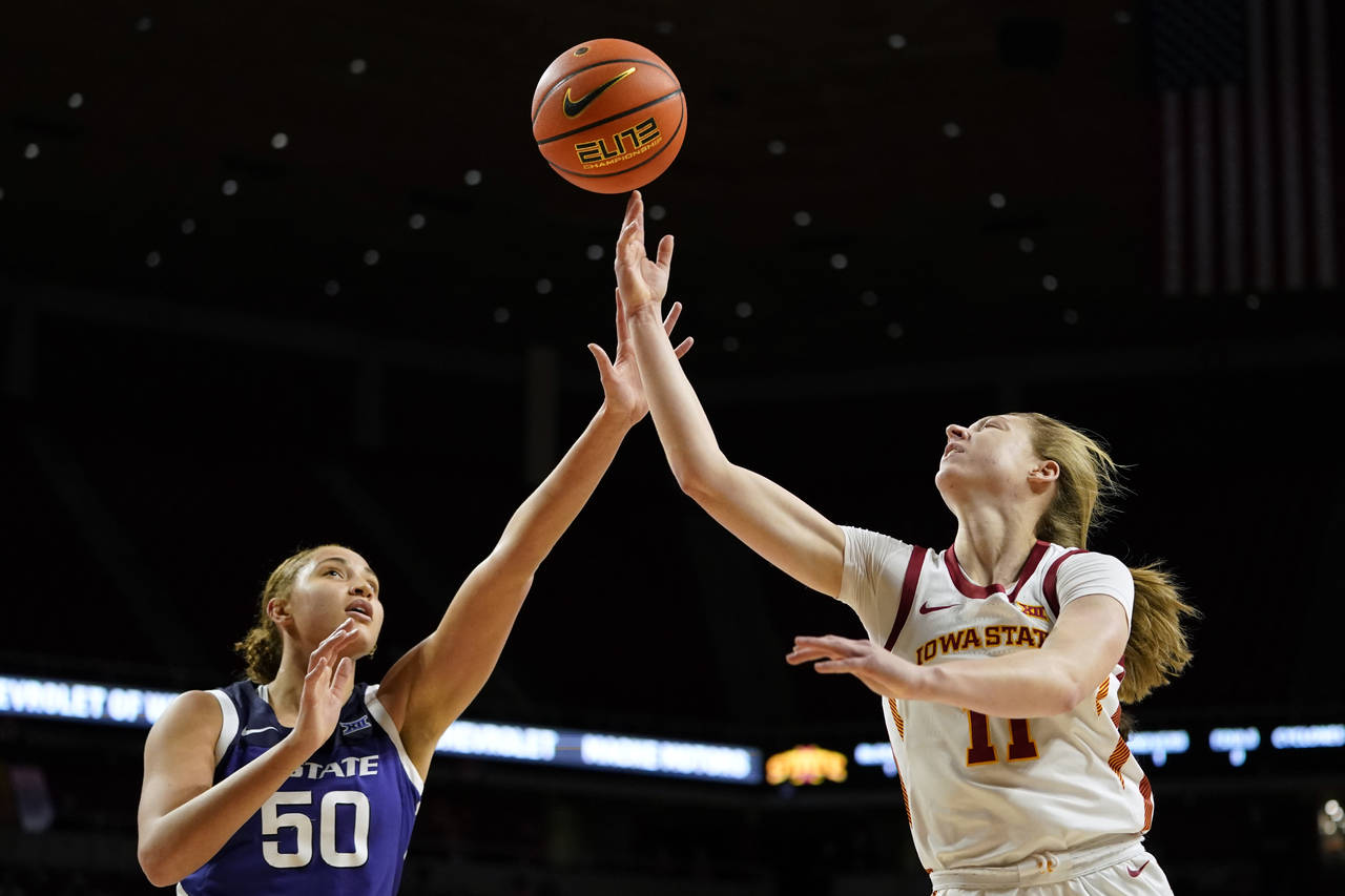 Iowa State guard Emily Ryan (11) shoots over Kansas State center Ayoka Lee (50) during the first ha...