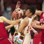 
              Indiana's Ali Patberg, left, and Aleksa Gulbe, right, reach for a rebound against Nebraska's Bella Cravens, center, during the first half of an NCAA college basketball game Monday, Feb. 14, 2022, in Lincoln, Neb. (AP Photo/Rebecca S. Gratz)
            