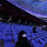 
              People wait for the opening ceremony of the 2022 Winter Olympics, Friday, Feb. 4, 2022, in Beijing. (AP Photo/Jae C. Hong)
            