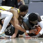 Washington State forward Mouhamed Gueye (35) wrestles for the ball with Arizona State forward Kimani Lawrence, left, and Washington State guard Tyrell Roberts (2) during the first half of an NCAA college basketball game, Saturday, Feb. 12, 2022, in Pullman, Wash. (AP Photo/August Frank)
