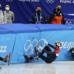 
              Ren Ziwei, left, of China, Brendan Corey of Australia, and Itzhak Laat, centre, of the Netherlands, crash in their quarterfinal of the men's 1,000-meter during the short track speedskating competition at the 2022 Winter Olympics, Monday, Feb. 7, 2022, in Beijing.
            