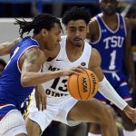 
              Tennessee State guard Tajik Bartholomew (3) is defended by Murray State guard Carter Collins (13) during the first half of an NCAA college basketball game Thursday, Feb. 10, 2022, in Nashville, Tenn. (AP Photo/Mark Zaleski)
            