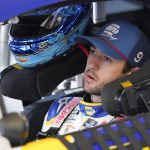 
              Chase Elliott gets ready to exit his car in his garage during practice for the Daytona 500 auto race at Daytona International Speedway, Saturday, Feb. 19, 2022, in Daytona Beach, Fla.. (AP Photo/John Raoux)
            