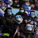 
              Spectators watch the men's snowboard big air finals of the 2022 Winter Olympics, Tuesday, Feb. 15, 2022, in Beijing. (AP Photo/Jae C. Hong)
            