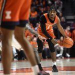 
              Illinois' Trent Frazier looks to pass the ball during the first half of the team's NCAA college basketball game against Ohio State on Thursday, Feb. 24, 2022, in Champaign, Ill. (AP Photo/Michael Allio)
            