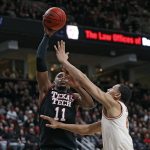 
              Texas Tech's Bryson Williams (11) shoots the ball over Texas' Dylan Disu (4)during the first half of an NCAA college basketball game on Tuesday, Feb. 1, 2022, in Lubbock, Texas. (AP Photo/Brad Tollefson)
            