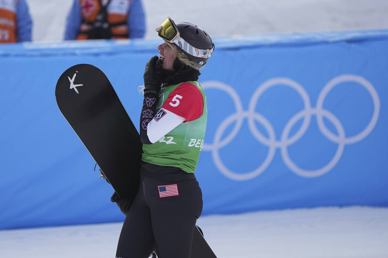 United States' Lindsey Jacobellis celebrates after winning a gold medal in the women's cross finals...