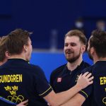 
              Team Sweden celebrates their win in the men's curling final match between Britain and Sweden at the Beijing Winter Olympics Saturday, Feb. 19, 2022, in Beijing. (AP Photo/Brynn Anderson)
            