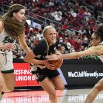 
              Louisville guard Hailey Van Lith, center, tries to get past Notre Dame forward Maddy Westbeld (34), left, and guard Olivia Miles (5) during the second half of an NCAA college basketball game in Louisville, Ky., Sunday, Feb. 13, 2022. (AP Photo/Timothy D. Easley)
            