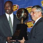 
              FILE - Chicago Bulls' Michael Jordan, left, receives the NBA Finals Most Valuable Player trophy from Commissioner David Stern during a ceremony in Chicago on June 18, 1996. (AP Photo/Charles Bennett, File)
            