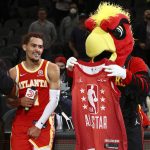 
              Atlanta Hawks guard Trae Young is all smiles looking on as team mascot Harry the Hawk shows off his All-Star jersey after the NBA basketball game against the Cleveland Cavaliers on Tuesday, Feb. 15, 2022, in Atlanta. (Curtis Compton/Atlanta Journal-Constitution via AP)
            