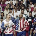 
              FILE - United States' John Stockton, from left, Chris Mullin, Charles Barkley and Magic Johnson celebrate with their gold medals after beating Croatia 117-85 at the Summer Olympic Games in Barcelona on Aug. 8, 1992. (AP Photo/John Gaps III, File)
            