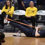 
              Connecticut's Paige Bueckers warms up with the team before an NCAA college basketball game against Marquette, Wednesday, Feb. 23, 2022, in Hartford, Conn. (AP Photo/Jessica Hill)
            