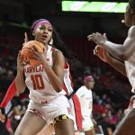 
              Maryland's Angel Reese (10) grabs a rebound against Ohio State in the second half of an NCAA college basketball game, Thursday, Feb. 17, 2022, in College Park, Md. (AP Photo/Gail Burton)
            