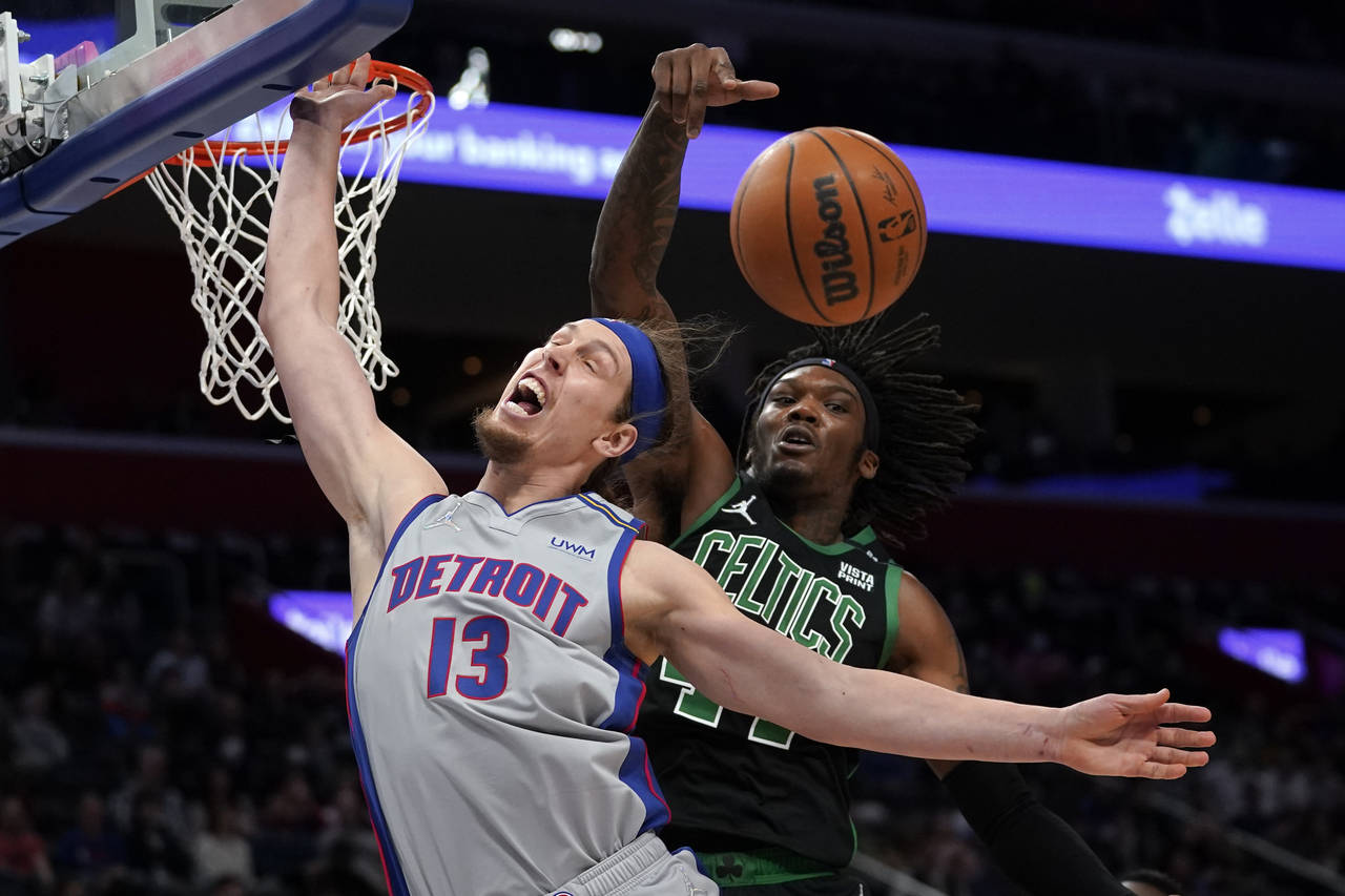 Boston Celtics center Robert Williams III (44) blocks a Detroit Pistons forward Kelly Olynyk (13) s...