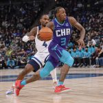 
              Charlotte Hornets guard Terry Rozier drives past Minnesota Timberwolves guard Jaylen Nowell during the second half of an NBA basketball game Tuesday, Feb. 15, 2022, in Minneapolis. The Timberwolves won 126-120 in overtime. (AP Photo/Craig Lassig)
            