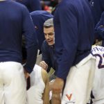
              Virginia head coach Tony Bennett talks with players in the huddle during an NCAA college basketball game against Miami in Charlottesville, Va., Saturday, Feb. 5, 2022. (AP Photo/Andrew Shurtleff)
            