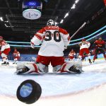 
              A shot gets past Denmark goalkeeper Lisa Jensen (30) for a goal by Japan during a preliminary round women's hockey game at the 2022 Winter Olympics, Saturday, Feb. 5, 2022, in Beijing. (Brian Snyder/Pool Photo via AP)
            