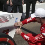
              Scott McLaughlin places the NTT P1 award to his car after qualifying for the Grand Prix of St. Petersburg auto race  Saturday, Feb. 26, 2022 in St. Petersburg, Fla. (Luis Santana/Tampa Bay Times via AP)
            