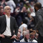 
              Connecticut coach Dan Hurley, left, listens to associate head coach Kimani Young, right, during the first half of the team's NCAA college basketball game against Villanova, Tuesday, Feb. 22, 2022, in Hartford, Conn. (AP Photo/Jessica Hill)
            