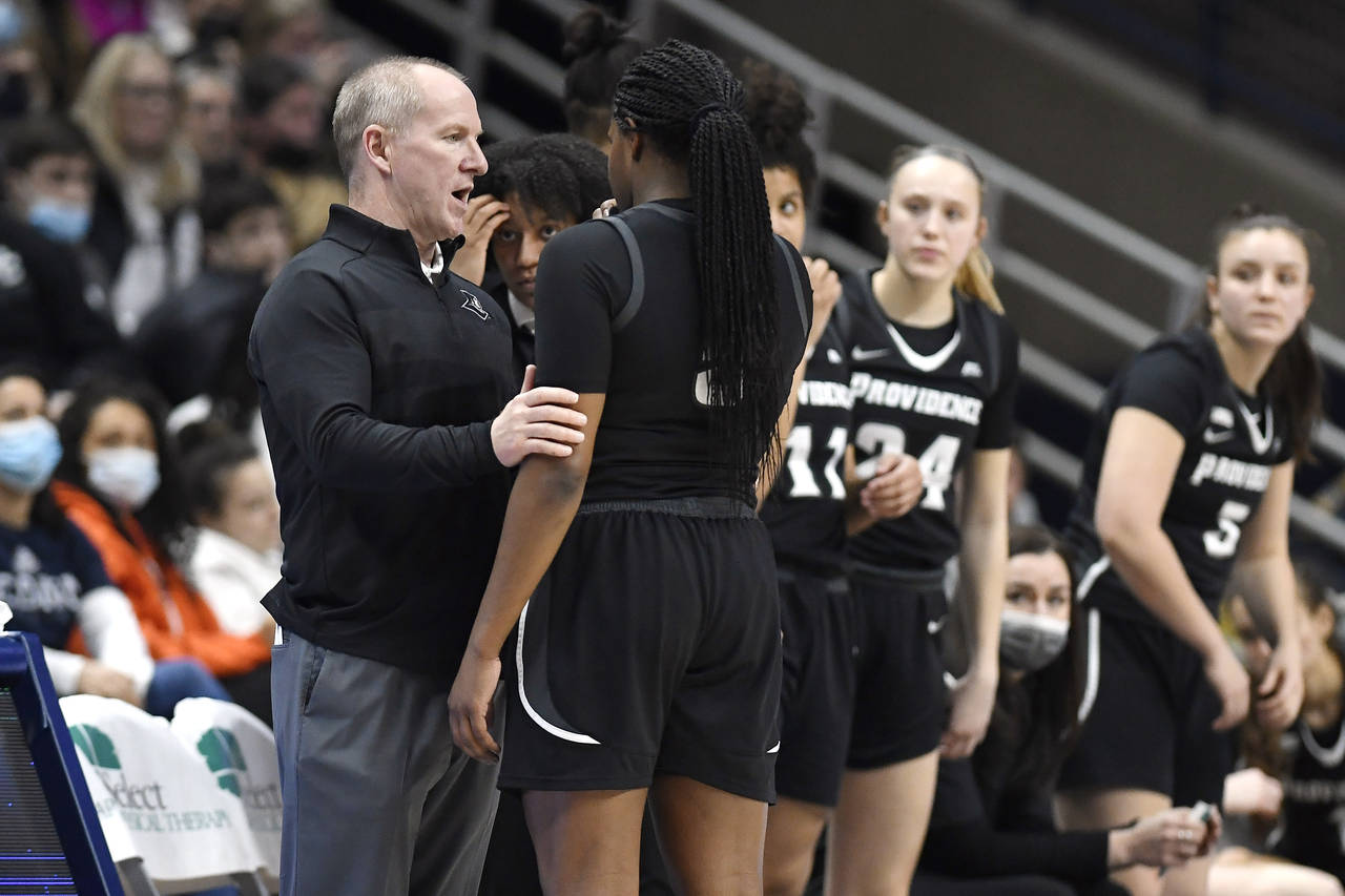 Providence head coach Jim Crowley talks with Providence's Janai Crooms (5) in the second half of an...