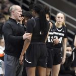 
              Providence head coach Jim Crowley talks with Providence's Janai Crooms (5) in the second half of an NCAA college basketball game against Connecticut, Sunday, Feb. 27, 2022, in Storrs, Conn. (AP Photo/Jessica Hill)
            