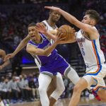 
              Sacramento Kings guard Tyrese Haliburton, front left, is guarded by Oklahoma City Thunder guard Ty Jerome (16) during the second half of an NBA basketball game in Sacramento, Calif., Saturday, Feb. 5, 2022. The Kings won 113-103. (AP Photo/Randall Benton)
            