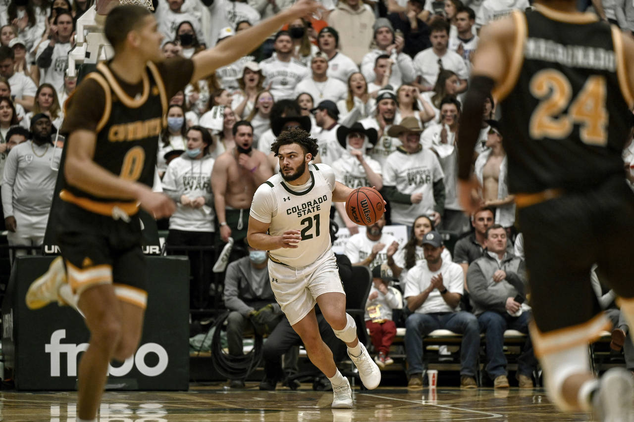 Colorado State's David Roddy (21) runs in transition during the first half of an NCAA college baske...