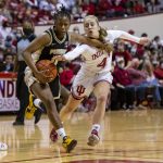
              Indiana guard Nicole Cardano-Hillary (4) attempts to stop a drive to the basket by Purdue guard Brooke Moore (0) during the first half of an NCAA college basketball game, Sunday, Feb. 6, 2022, in Bloomington, Ind. (AP Photo/Doug McSchooler)
            
