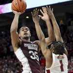 
              Mississippi State forward Tolu Smith (35) shoots over Arkansas guard JD Notae (1) during the second half of an NCAA college basketball game Saturday, Feb. 5, 2022, in Fayetteville, Ark. (AP Photo/Michael Woods)
            