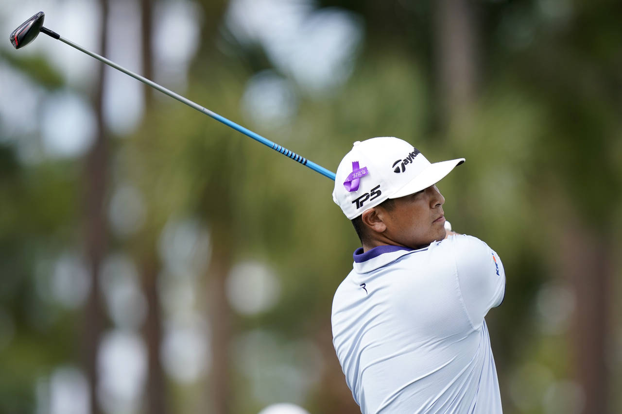 Kurt Kitayama hits from the ninth tee during the first round of the Honda Classic golf tournament, ...