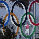 
              A person stands in the Olympic Rings during a cross-country skiing training session before the 2022 Winter Olympics, Thursday, Feb. 3, 2022, in Zhangjiakou, China. (AP Photo/Alessandra Tarantino)
            