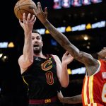 
              Cleveland Cavaliers forward Kevin Love (0) goes up for a shot as Atlanta Hawks guard Lou Williams (6) defends during the second half of an NBA basketball game Tuesday, Feb. 15, 2022, in Atlanta. (AP Photo/John Bazemore)
            